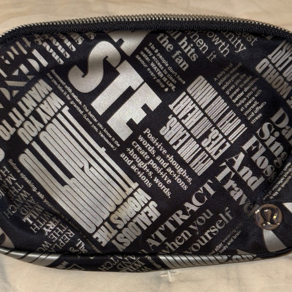 Lululemon Handbags - Lululemon Athletica Black and Silver Text Travel Bag
Cross Posted!
